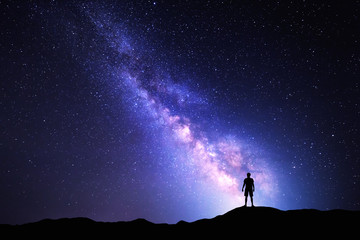 Milky Way. Night sky and silhouette of a standing man - Powered by Adobe