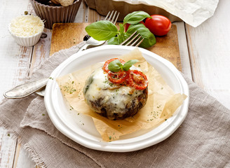 Baked portobello mushroom stuffed with cheese and vegetables. Delicious and nutritious vegetarian dish