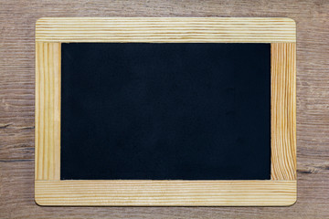 Empty black chalkboard in a wooden frame
