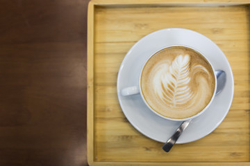 Hot art Latte Coffee in the table
