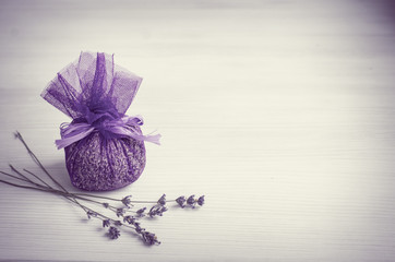 Sack of lavender. Fragrant bag of lavender flowers. Sprigs of lavender near the bag with Lavender. selective focus.Vintage effect