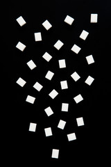 Fototapeta na wymiar sugar cubes isolated on black background