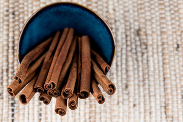 Organic Cinnamon sticks in a blue bowl