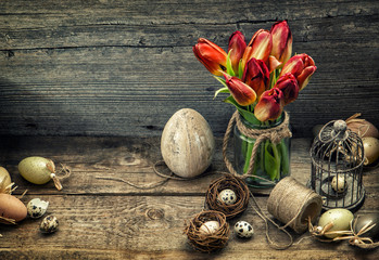 Easter decoration with eggs tulip flowers. Vintage toned