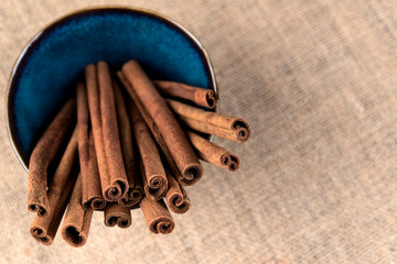 Organic Cinnamon sticks in a blue bowl