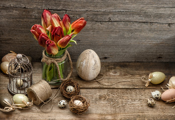 Easter decoration with eggs and tulip flowers. Country style
