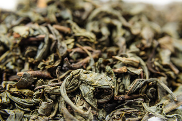 Background of dry green tea with flavors