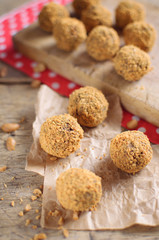 Sweet peanut balls on wooden background