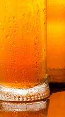 Mug with cold beer. Detail close-up