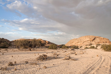 sunset with rain clouds at the edge of the Namib desert