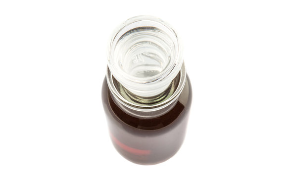 Maple vinegar in glass vial over white background