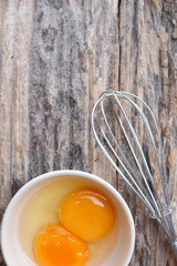 Eggs in a bowl with whisk