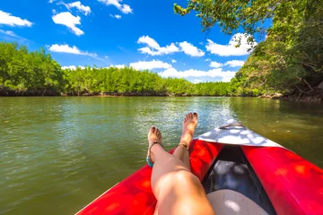Foto op Canvas Tanned legs on kayak © bennymarty
