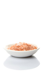 Fototapeta na wymiar Himalaya or Himalayan rock salt in white bowl over white background