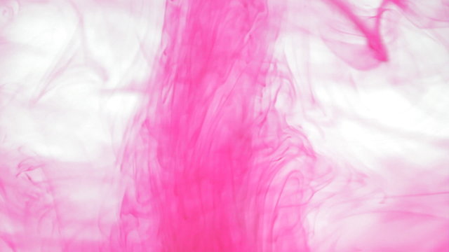 pink ink spread out in clean water