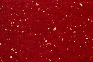 Japanese red paper with gold patterns.