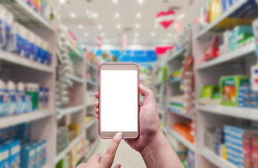 The women using smartphone in pharmacy