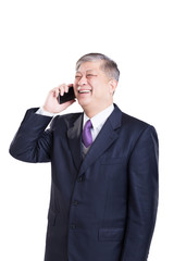 pose and gesture of old Asian businessman in suit with cellphone