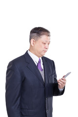 pose and gesture of old Asian businessman in suit with cellphone