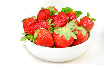 Strawberry in the bowl on the white background