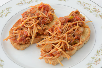 Open faced spaghetti sandwich with whole wheat pasta and whole wheat bread 