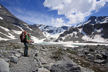 Young happy backpacker enjoying the mountain views in Wedgemount Lake Area of Garibaldi Park near...