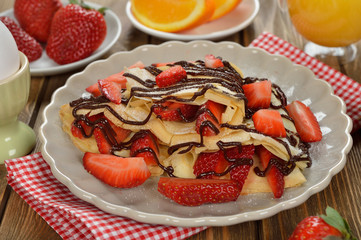 Crepes with strawberries and chocolate