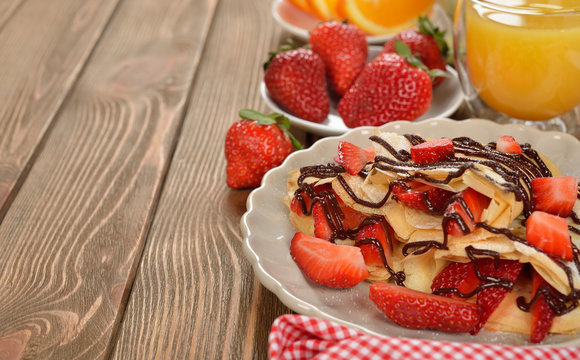 Crepes with strawberries and chocolate