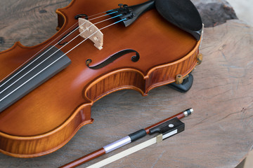 Fototapeta premium Close up of a violin on wooden surface 
