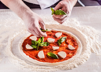 chef making pizza