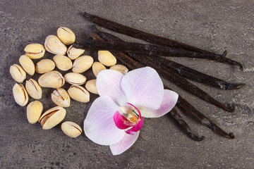 Pistachio nuts, blooming orchid and fragrant vanilla sticks, cosmetic ingredients