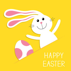 Happy Easter. Bunny rabbit hareand pink painted egg in the paper pocket. Baby greeting card. Yellow background. Flat design.