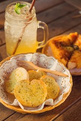 Garlic bread served in baskets on table
