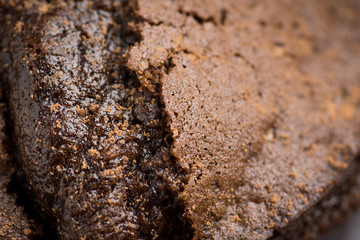 Chocolate muffin on the dark rustic wooden background