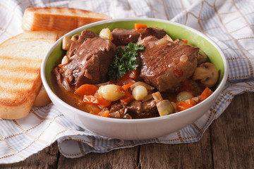 Freshly cooked Beef Bourguignon close up in a bowl. horizontal
