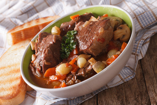 French cuisine: beef Bourguignon close up in a bowl. horizontal
