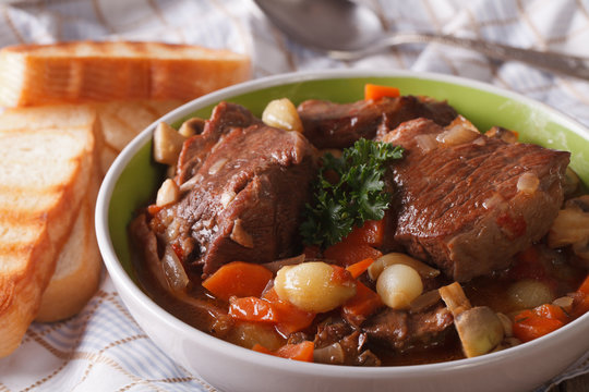 Hot Beef Bourguignon with mushrooms and vegetables in a bowl 
