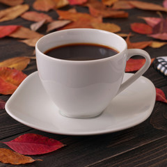 cup of aromatic coffee americano with notepad and pen