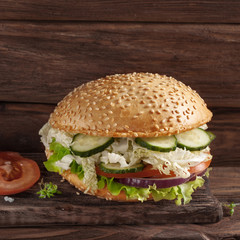 fresh veggie burger on a dark rustic background