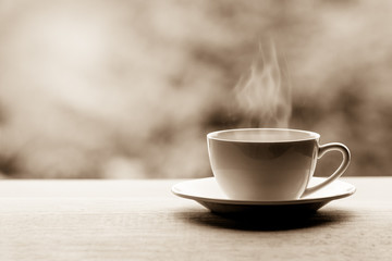 Hot americano, Black coffee in white cup on wooden table.