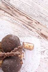 Cupcake with chocolate on wooden background