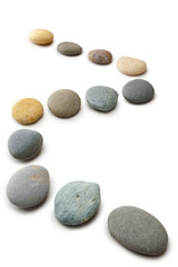 Snaking Line of Twelve Pebbles Steps Isolated Vertical