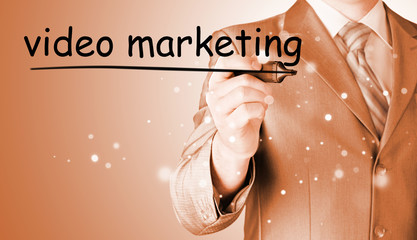 business man writing Video Marketing