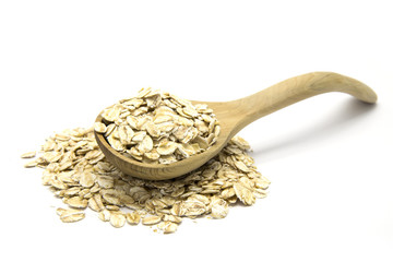 Rolled oats in wooden spoon