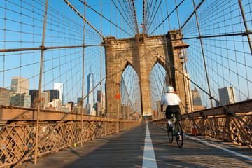 Cyclist Riding on Brooklyn Bridge Pedestrian Path