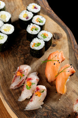 Closeup of fresh sushi on rustic wooden table