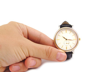 Close up of hand holding watch, isolated on white background. Time concept