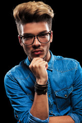 interesting fashionable man wearing denim and glasses posing thi