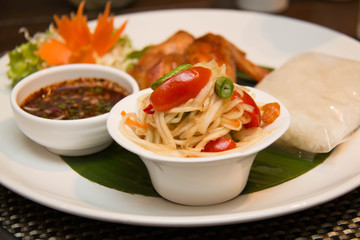  Green papaya salad, grilled chicken and sticky rice