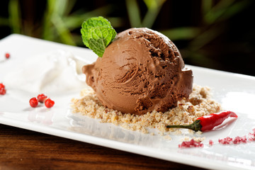 Fine dining, chocolate ice cream with red pepper and chili